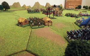 Orc archers fire from the farmstead into the encroaching elves